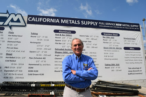 CEO Jerry Turchin stands under sign of California Metals Supply, where companies may purchase metals to be used in manufacturing
