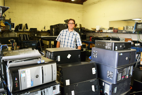 Josh Turchin, president of California Metals, with computers awaiting disassembly