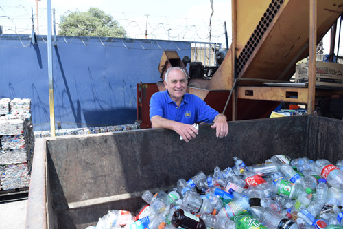 Jerry Turchin at bin for recycled bottles