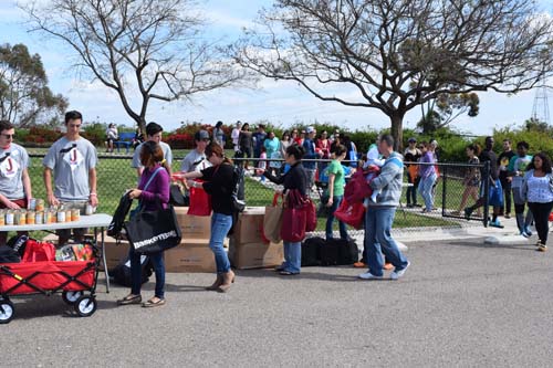 Military Families queue for canned goods at Murphy Canyon Navy Housing complex