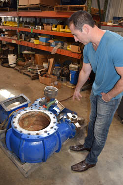 Ben Weinrib points to a portion of a pump assembly