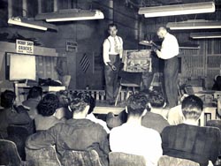 Morris Slayen, left, gives lessons in upholstery