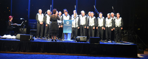 The San Diego Jewish Men's Choir entertained during the outdoor barbecue dinner on the football field of San Diego Jewish Academy.