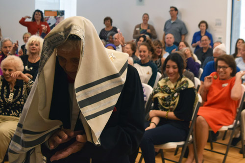 Lazar Abramovitch stayed covered in a tallit as celebrants showered him with soft candies