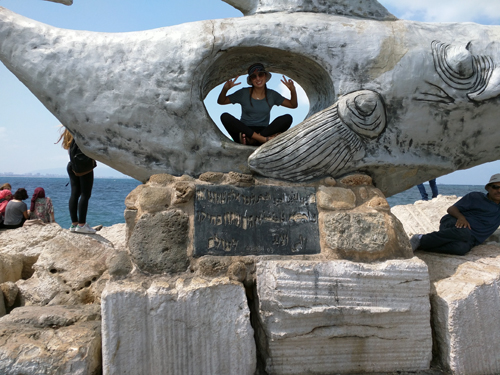 Like many tourists who visit Akko, Linda Williams could not resist imagining herself as Jonah